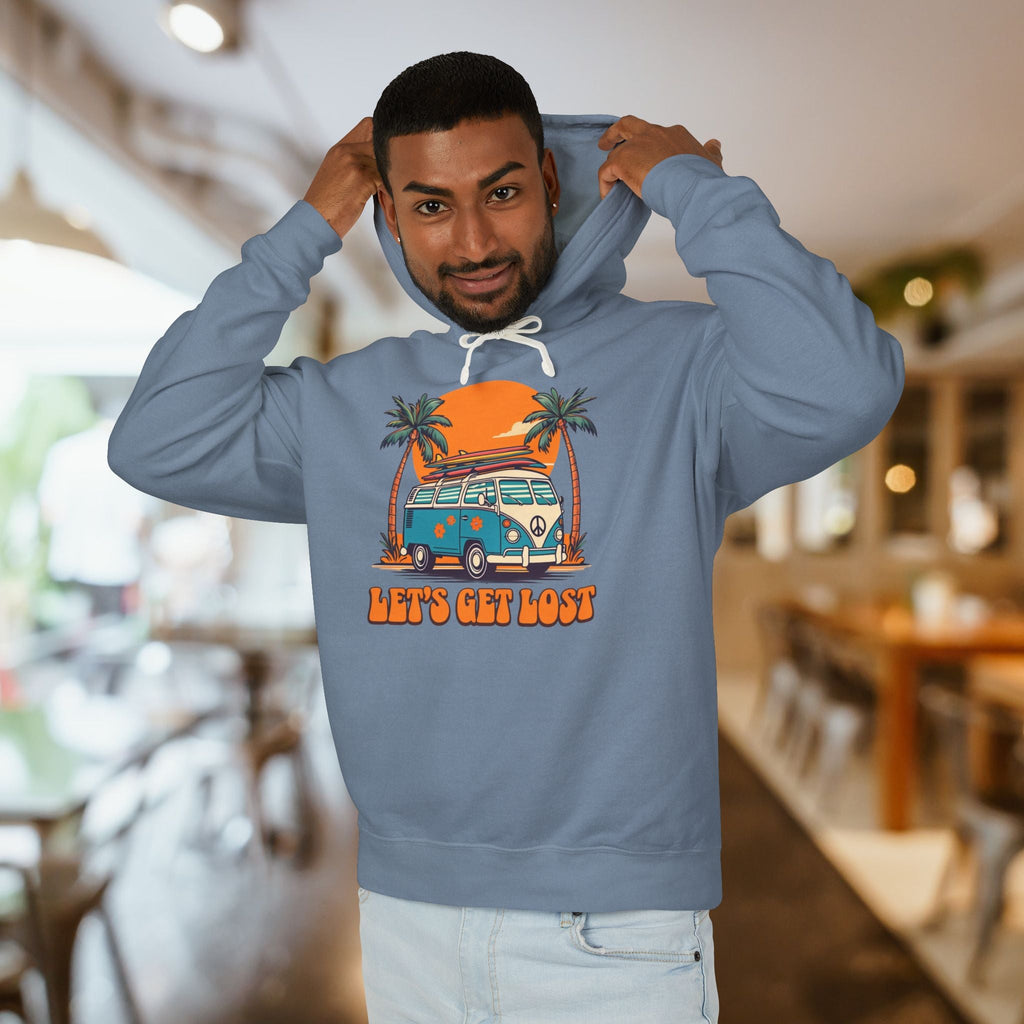 Man wearing a blue hoodie with a graphic design and text in a casual setting