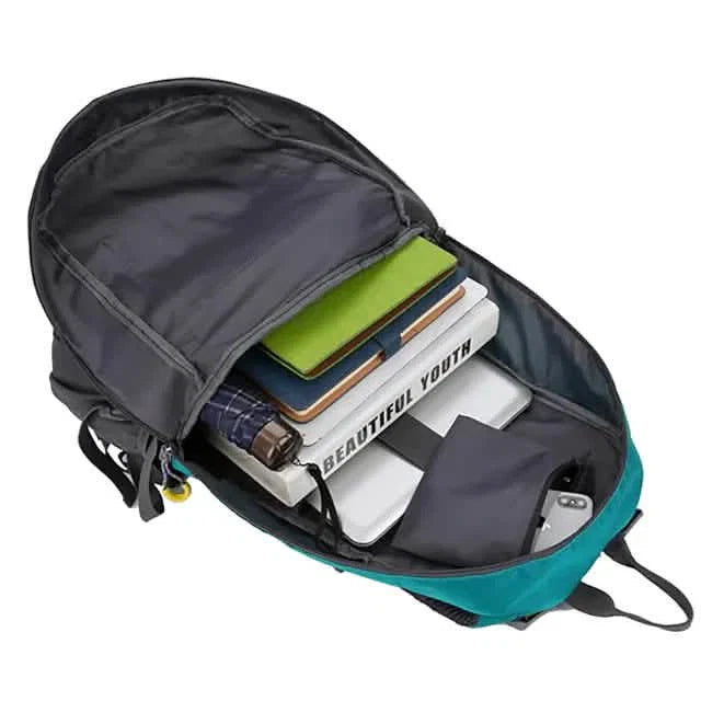 Open backpack with items including a book titled 'Beautiful Youth' on a white background