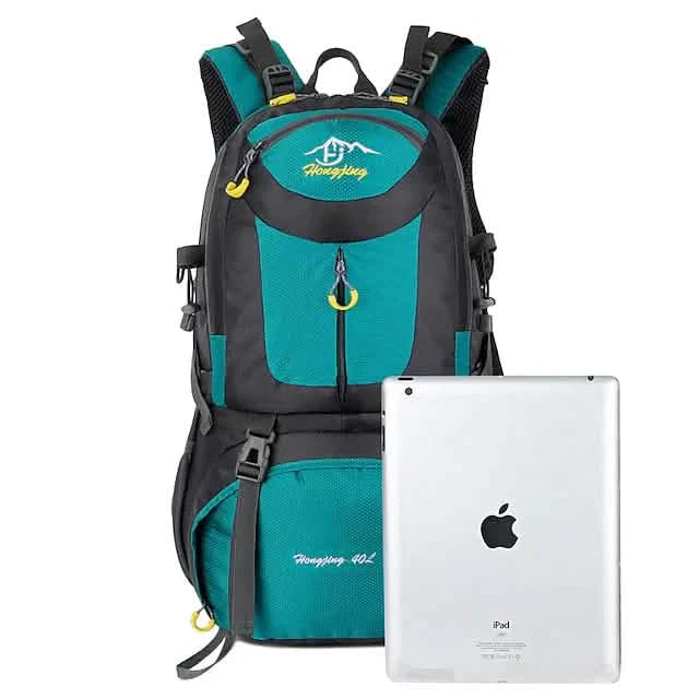 Teal and black backpack with a white Apple iPad on a white background