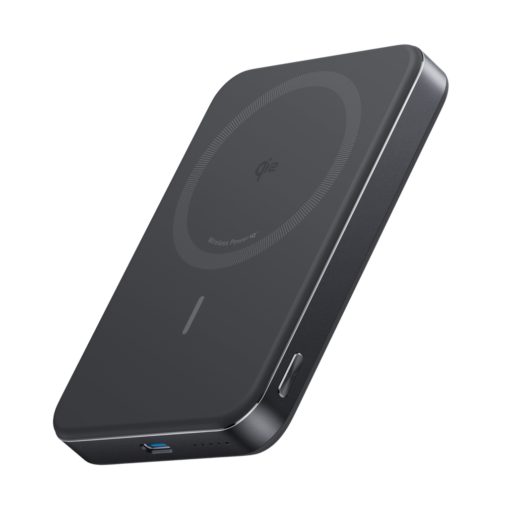 Black wireless charging pad on a white background