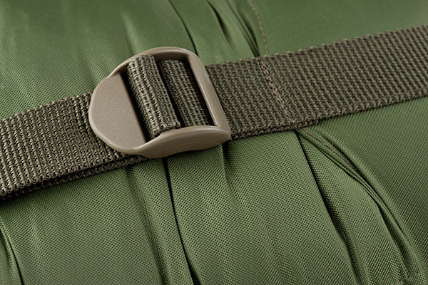 Close-up of a green bag with a brown strap and buckle.