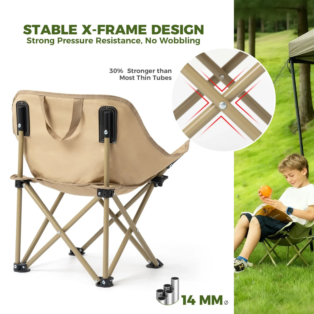 Beige folding chair with stable X-frame design, shown with a child reading in a grassy area.