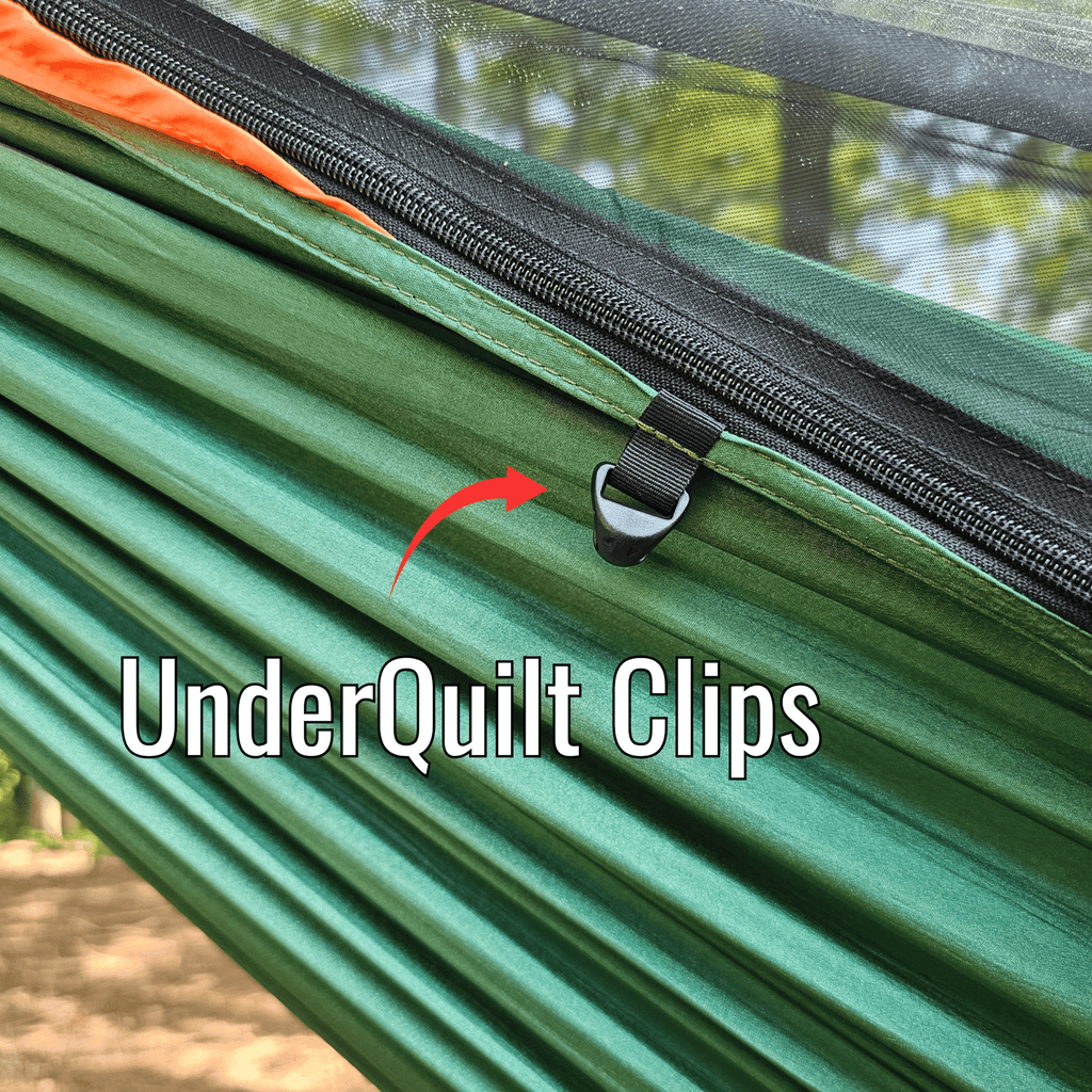 Green hammock with black zipper and UnderQuilt Clips label, outdoor setting.