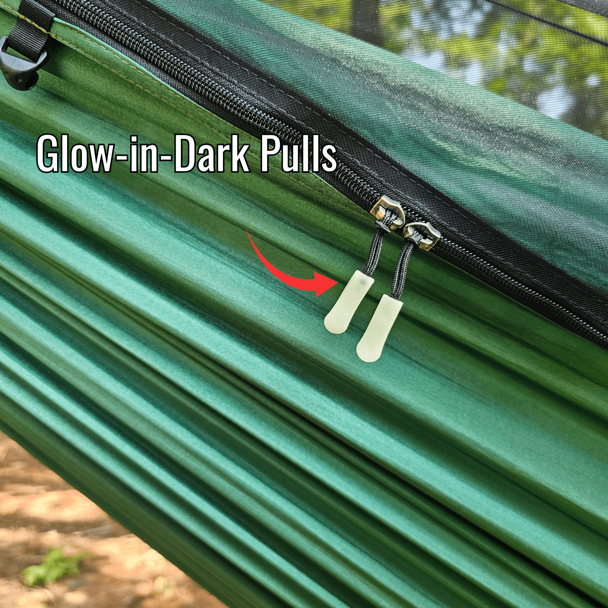 Green hammock with glow-in-the-dark zipper pulls and a blurred natural background.