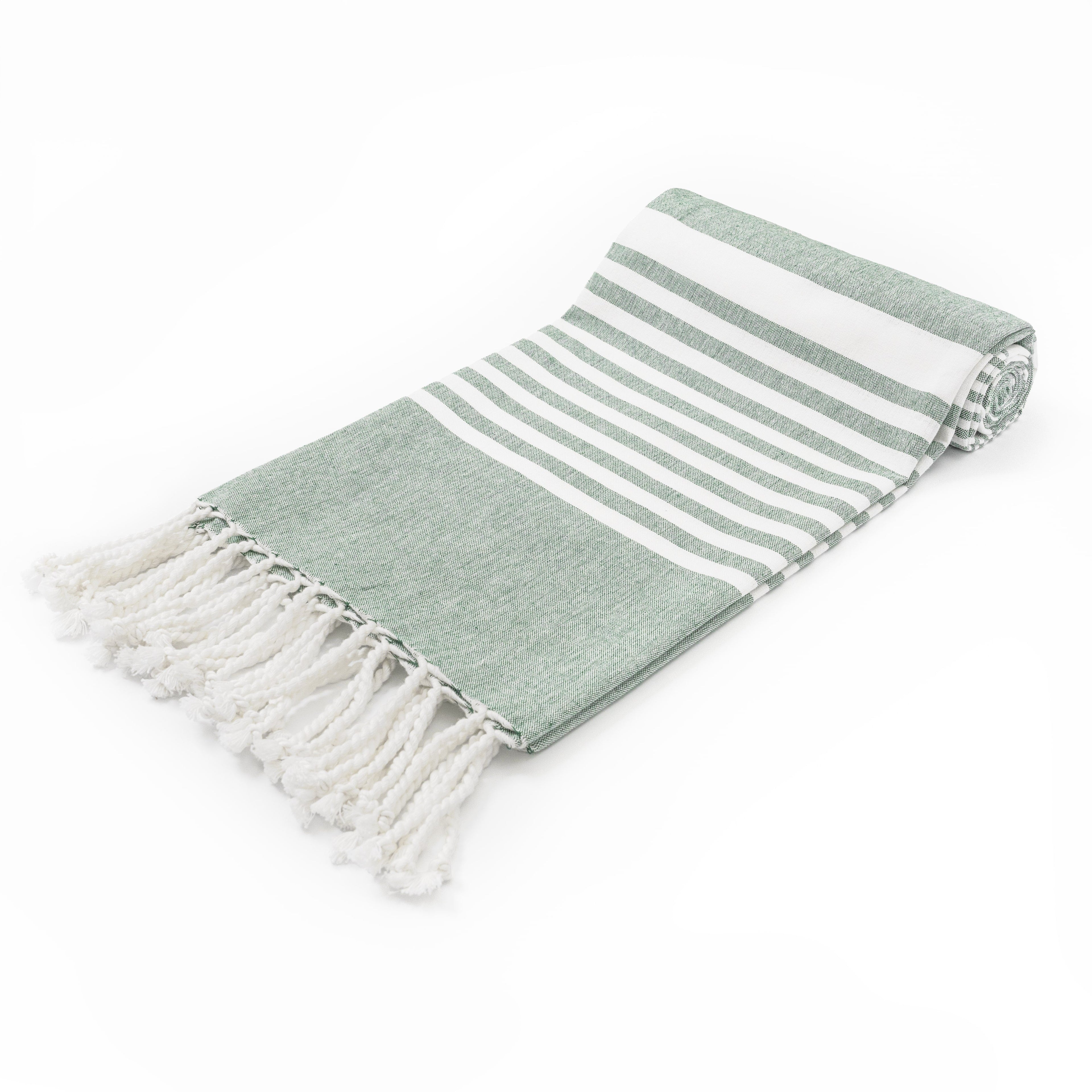 Folded green and white striped towel with tassels on a white background